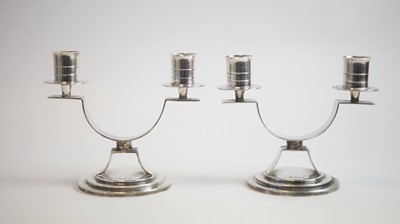 Lot 104 - A pair of silver twin branch candelabra