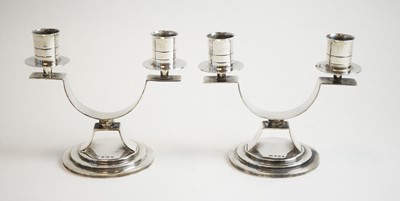 Lot 104 - A pair of silver twin branch candelabra