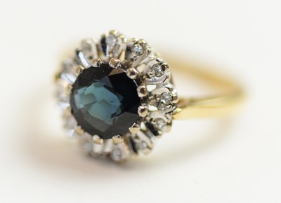 Lot 42 - A sapphire and diamond cluster ring