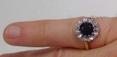 Lot 42 - A sapphire and diamond cluster ring