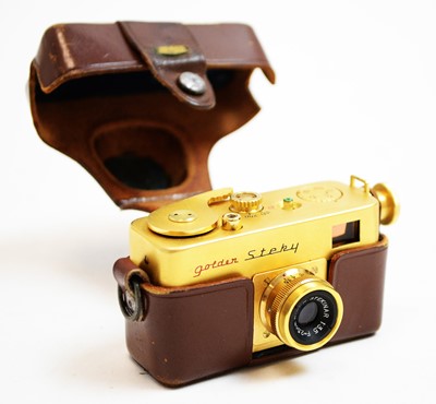 Lot 640 - A Riken Golden Steky subminiature camera; and Riken Steinar lens, cased.