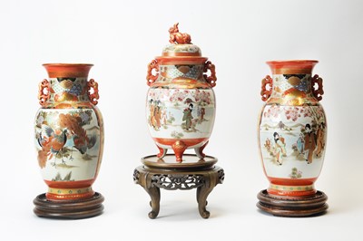 Lot 608 - Garniture of three Kutani vases and stands