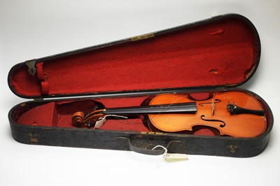 Lot 129 - Three cased violins; and a vintage violin case.