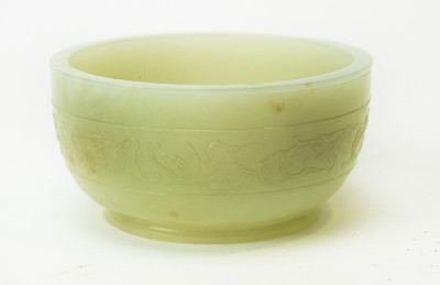 Lot 599 - Small pale green jade bowl