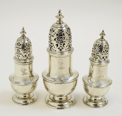 Lot 225 - George II suite of three silver casters