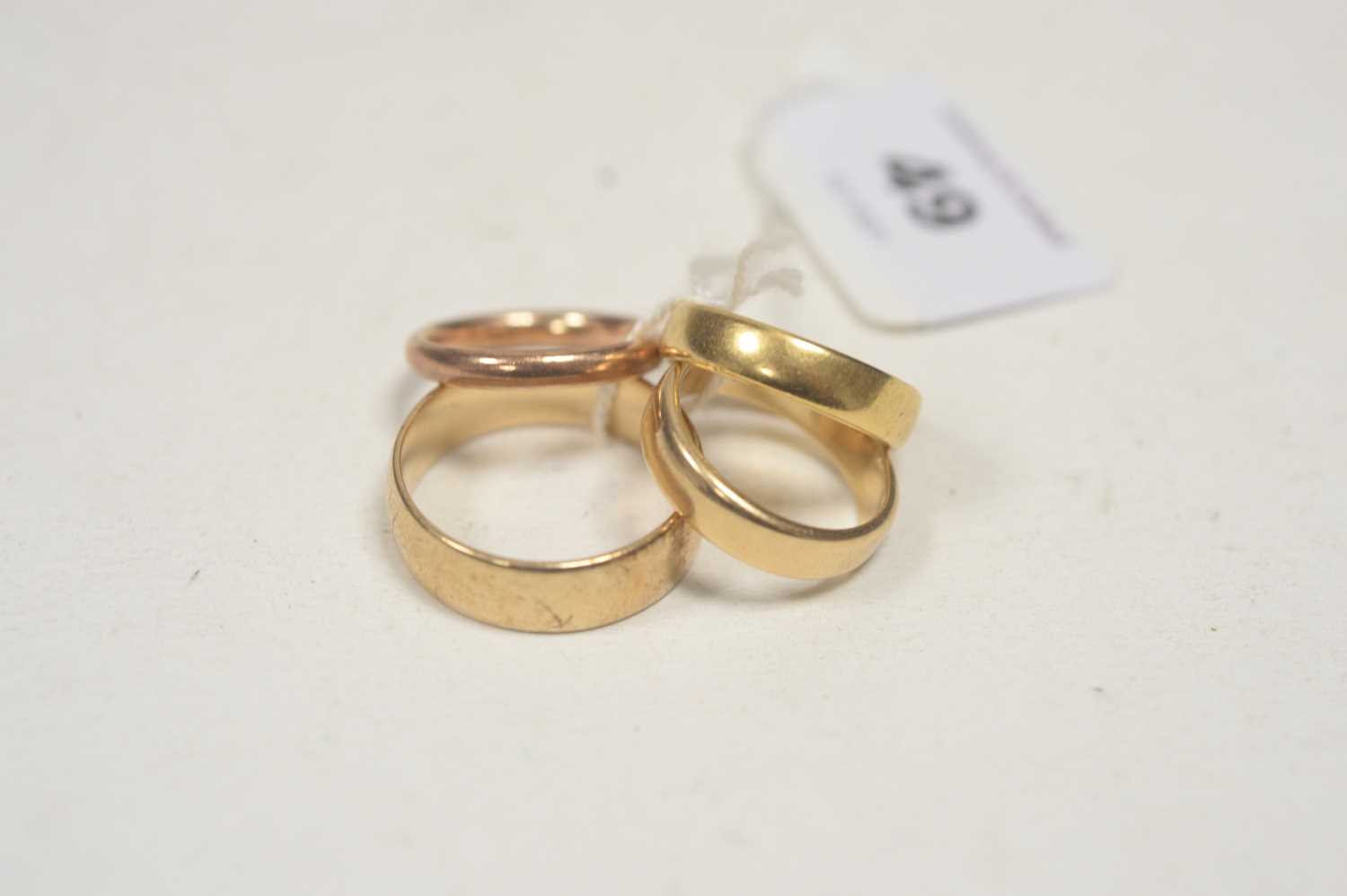 Lot 49 - Four gold rings.