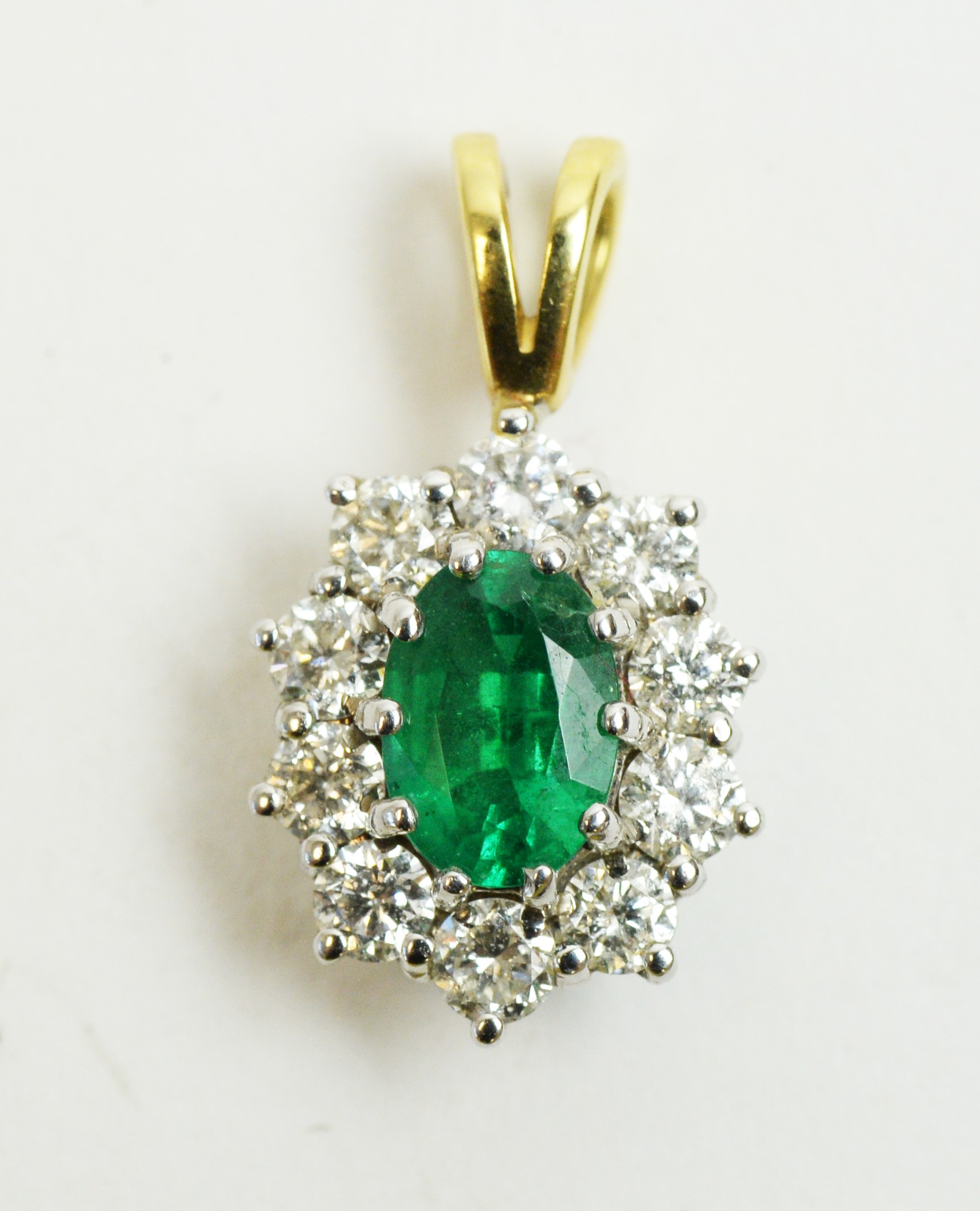 Lot 58 - Emerald and diamond pendant