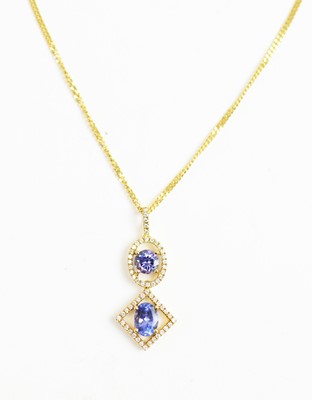 Lot 59 - A tanzanite and diamond drop pendant