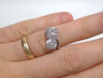 Lot 71 - A two stone diamond crossover ring
