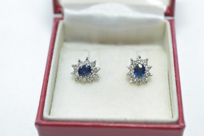Lot 77 - A pair of sapphire and diamond cluster earrings