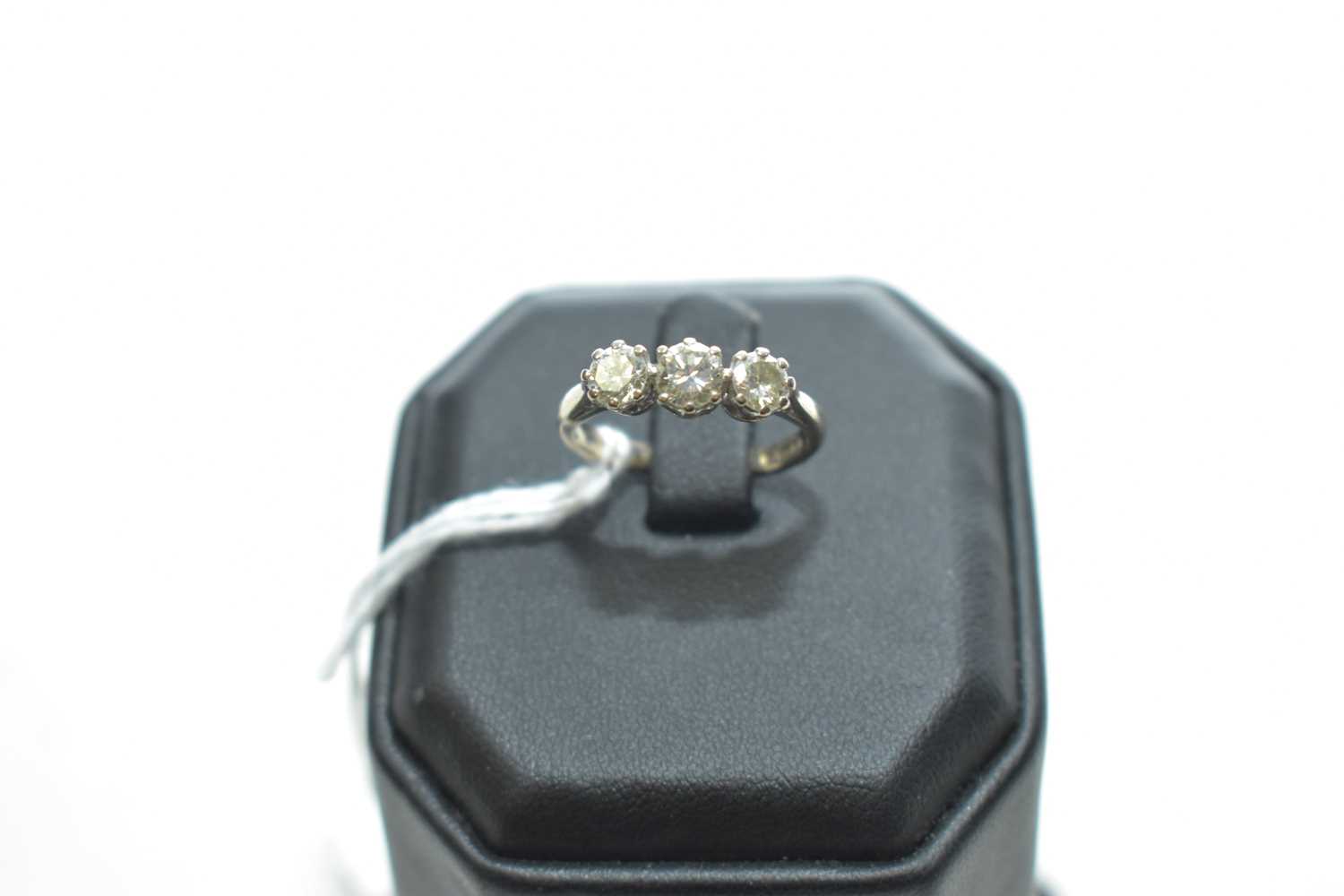 Lot 55 - A three stone diamond ring