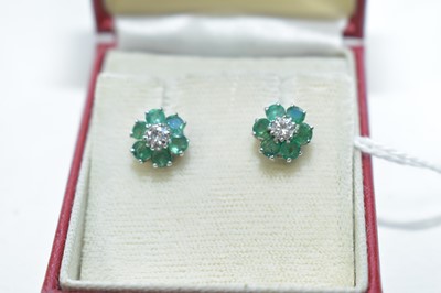 Lot 76 - An emerald and diamond cluster earrings