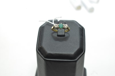 Lot 71 - Three stone emerald and diamond ring