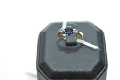 Lot 63 - A sapphire and diamond ring