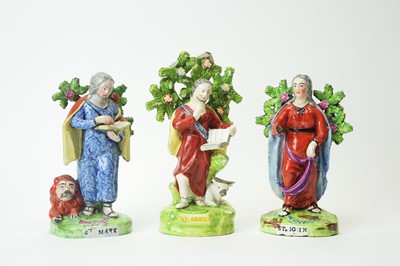 Lot 627 - Three Staffordshire pearlware figures Saints