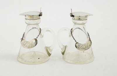 Lot 111 - A pair of silver mounted glass whisky tots