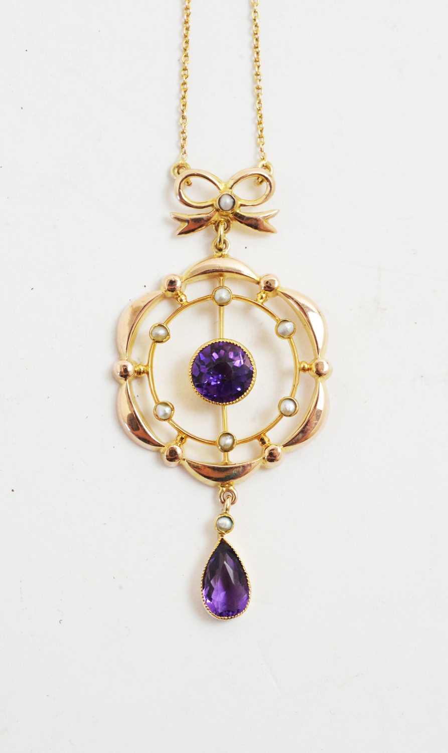 Lot 76 - Edwardian amethyst and seed pearl pendant