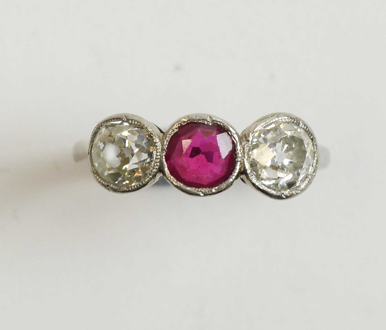 Lot 14 - Three stone ruby and diamond ring
