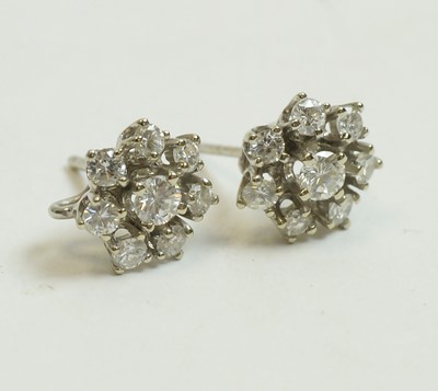 Lot 15 - A pair of diamond cluster earrings