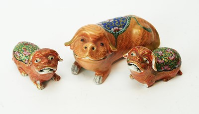 Lot 587 - three Chinese famille rose Fu dogs