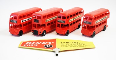 Lot 840 - Four London double-decker bus models; and a Dinky Toys sign.