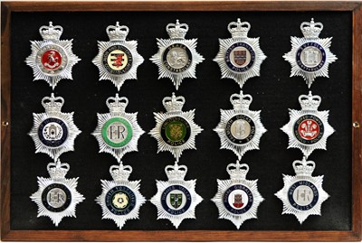 Lot 809 - A collection of 20th Century Police badges, framed.