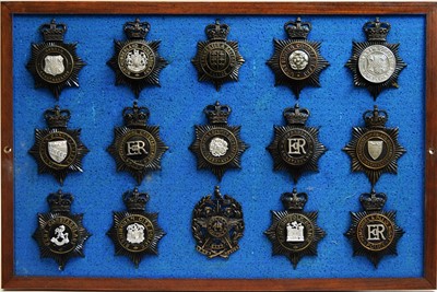 Lot 810 - A collection of Police helmet badges, framed.