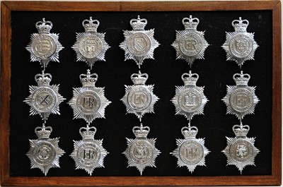 Lot 815 - A collection of 20th Century Police helmet badges, framed.