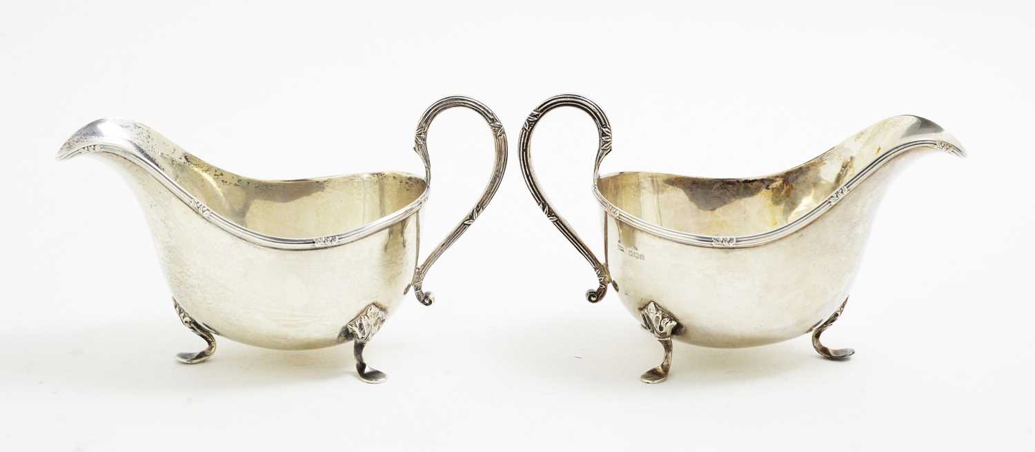 Lot 107 - A pair of silver sauce boats, by Walker & Hall