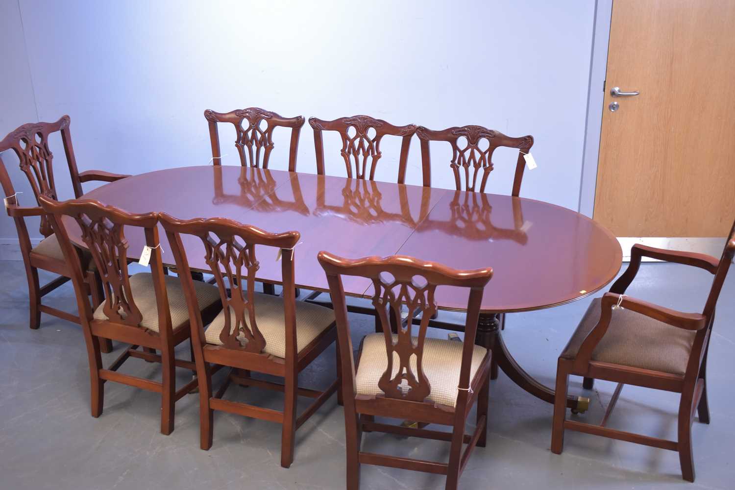 Lot 537 - Reproduction mahogany dining table and eight chairs