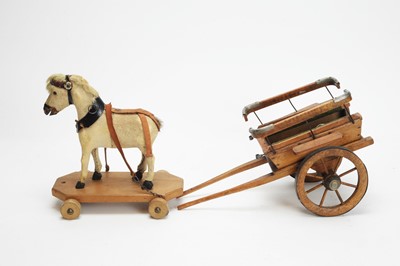 Lot 1112 - A late 19th Century pull-along toy pony and trap