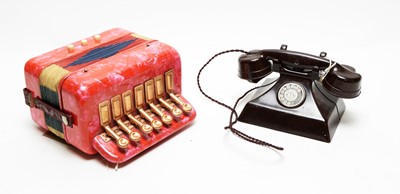 Lot 1115 - Toy telephone and accordion.