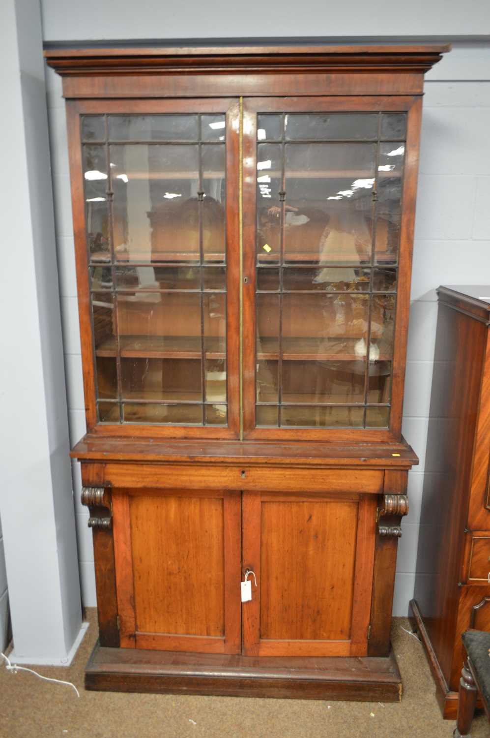 Lot 558 - An early 19th C mahogany display cabinet.