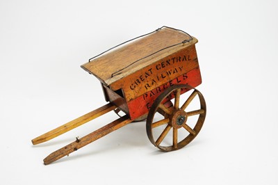 Lot 1121 - Early 20thC wooden and stencilled toy cart.