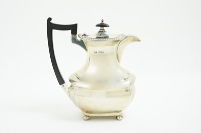 Lot 120 - A George V silver hot water jug.