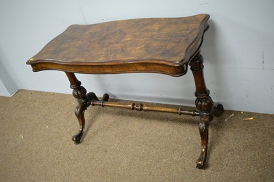 Lot 89 - A Victorian walnut reading table