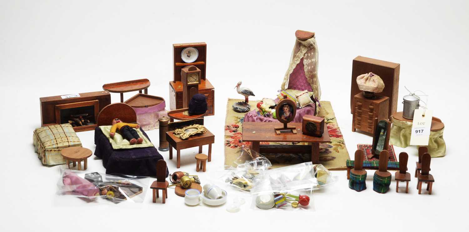 Lot 917 - A collection of vintage doll's house furniture.