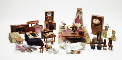 Lot 917 - A collection of vintage doll's house furniture.
