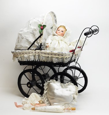 Lot 330 - A Victorian-style dolls pram and doll.