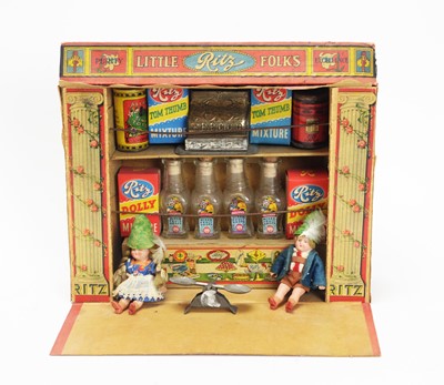 Lot 938 - Ritz Toys: a "Little Folks" printed card doll's shop; accessories; and two dolls.