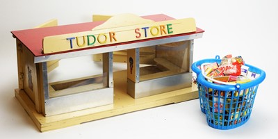 Lot 944 - A doll's mid 20th Century British shop "Tudor Store", and miniature groceries.