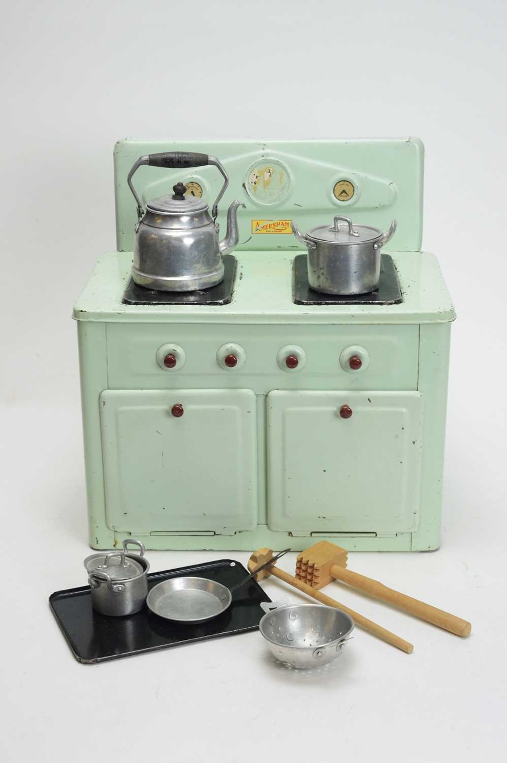 Lot 955 - Amersham Toys, Chesham, England: a doll's blue-green tinplate kitchen range.