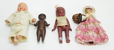 Lot 1010 - 20th Century painted metal baby doll, and three other dolls, various.