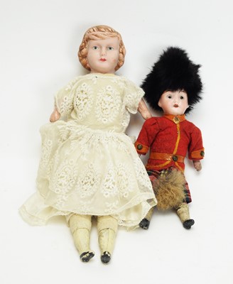 Lot 1019 - A late 19th Century English bisque head doll; and a German bisque head doll.