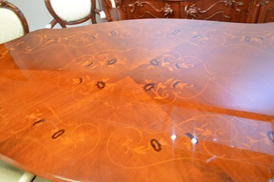 Lot 575 - An Italian inlaid walnut dining room suite.