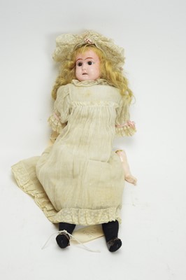 Lot 1034 - A late 19th Century English wax head doll.