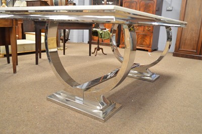 Lot 577 - A modern chrome dining table.