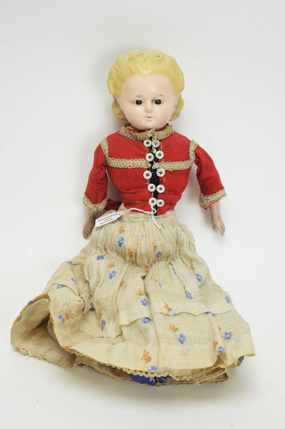 Lot 1036 - A 19th Century English wax-covered pumpkin head doll.