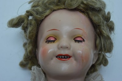Lot 1040 - A mid 20th C German "Shirley Temple" doll; and two baby dolls by Pedigree and Minerva.