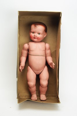 Lot 872 - A composition baby doll.